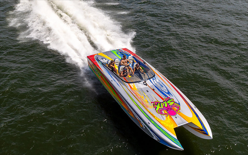 Speedboat on a lake withe the slix logo on the front of the boat