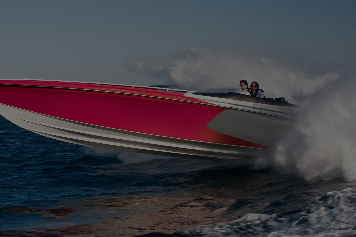 Magenta speed boat flying across the water